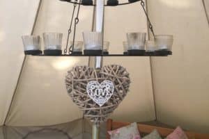 The double tea light chandelier in our glamping bell tent